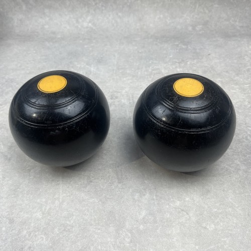Pair crown green bowls - of,