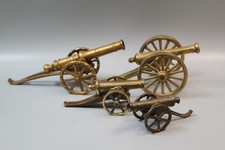 Set of four brass cannon desk