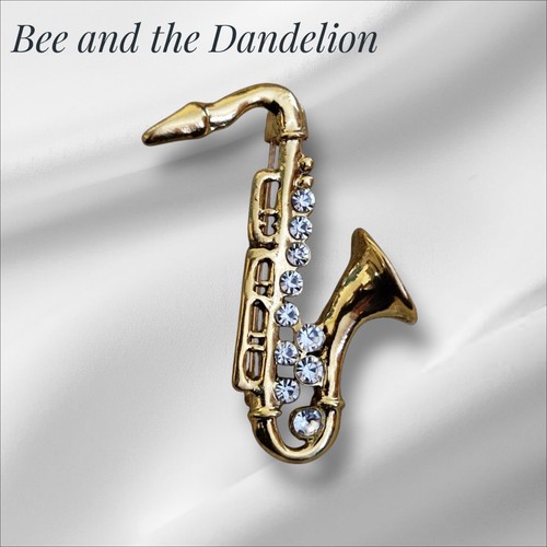 Gold tone saxophone crystal - gold,