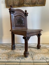 A handsome English 19thC, noble carved oak hall chair C1850, recent conservation