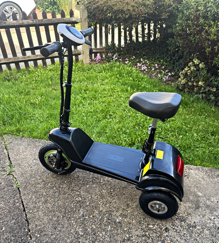 Black seated electric scooter - electric,