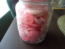 pink buttons in a jar
