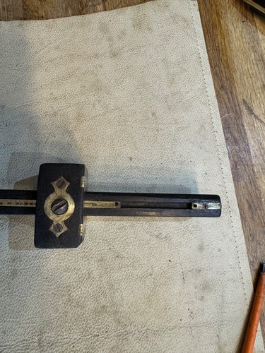 Brass and rosewood - and,