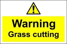 Caution grass cutting safety sign