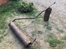 Antique lawn mower roller. 