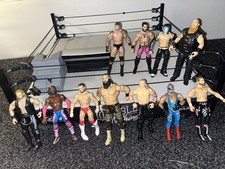  AEW ring set w/ steel steps and announce table ￼w/ AEW figures + WWE figures.