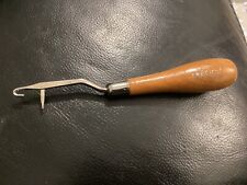 Two Readicut rug making tools