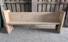 A STRIPPED PINE PEW MADE USING