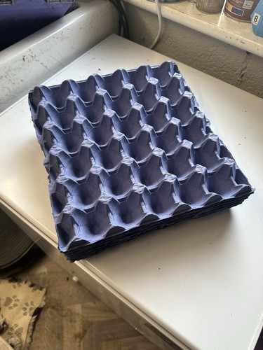 Grey cardboard egg trays - 🥚,