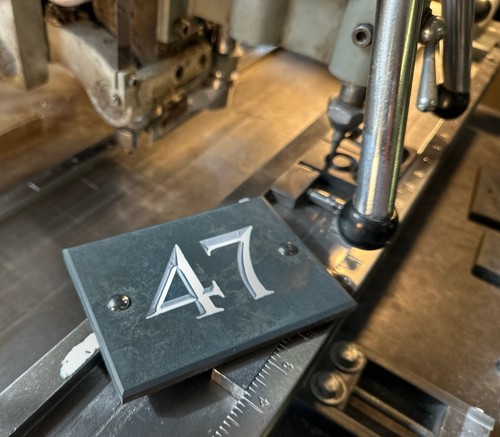 Hand engraved black slate - hand,