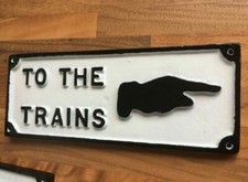 CAST METAL "TO THE TRAINS"