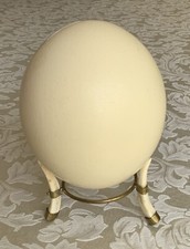 Ostrich egg with faux tusk stand 