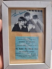 framed ticket stub and photo