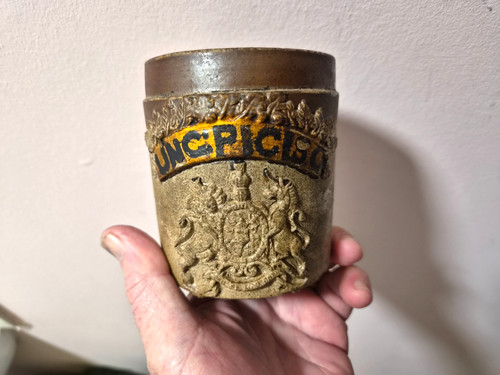 Antique stoneware coat of - an,