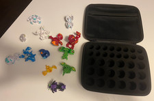 Selection of Bakugan toys (11 large and 2 small) and case