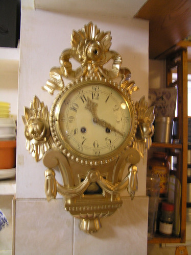Wall clock carved gilded