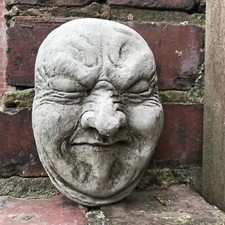 Fart poo face garden stone