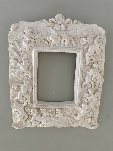 Plaster frame with - frame, cherubs