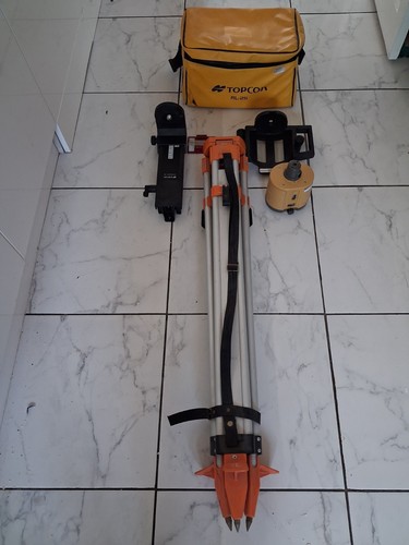 Used topcon laser and tripod - and,