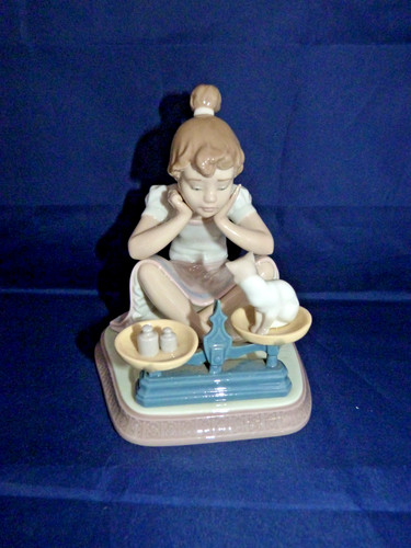 Lladro girl weighing a cat - girl,