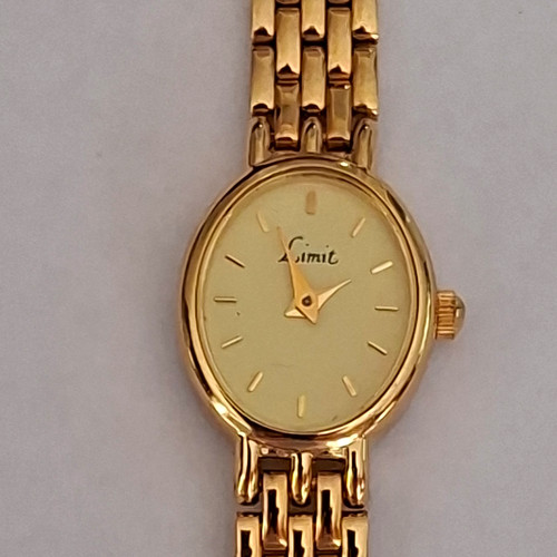 Limit gold tone oval quartz - tone,