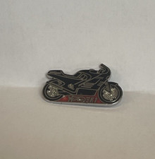 A vintage enamel Norton F1 motorbike pin badge