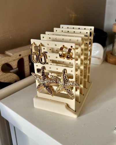 Cream earring display show - display,