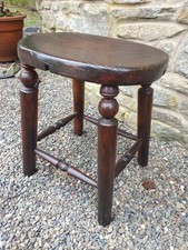 Antique elm oval top stool 4 legs & turned stretchers 35x28 by 43cm tall