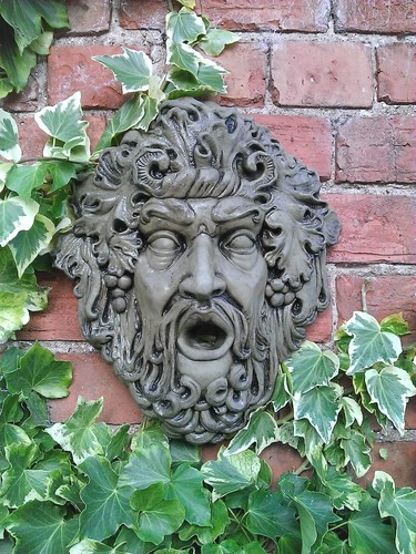 Stone garden god face - garden,