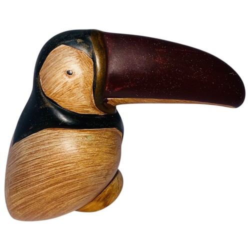 Hand carved wooden toucan - hand,