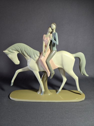Lladro style couple horse - on,