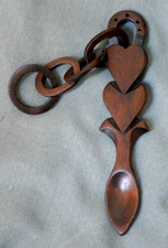 CARVED WELSH LOVE SPOON TWO HEARTS, CHAIN, HORSESHOE.
