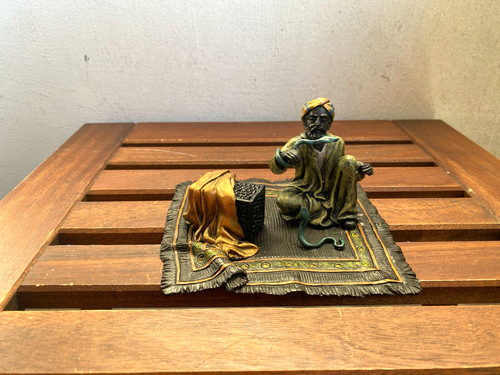 Colored bronze sculpture - of, an