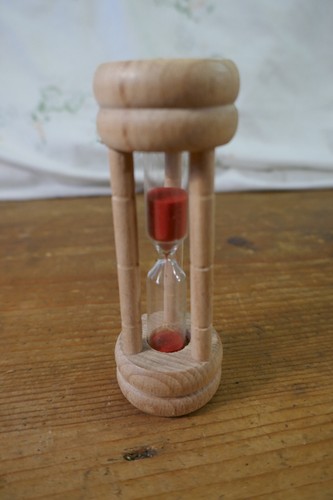 Small wooden egg timer with - a,