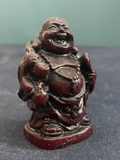 A vintage carved red resin laughing Buddha figurine Vgc