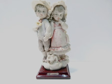 vintage porcelain figurine by Giuseppe Armani, titled "Boy and Girl Holding Hand