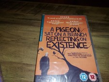 A Pigeon Sat On A Branch