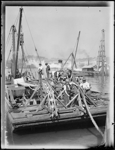 Men laying underwater - , cables