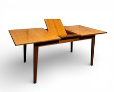 A LINE TEAK EXTENDING DINING
