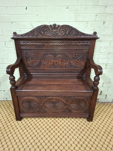 Carved oak settle with - oak, under