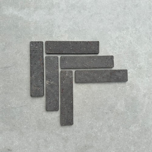 Black clay brick slips wall - brick,