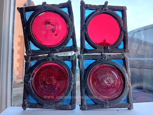 Four leaded roundel fragments