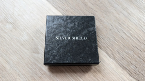 Silver shield empty coin box