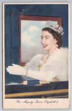 Queen Elizabeth II waving from carriage in crown and white fur