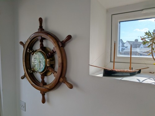 Nautical clock mounted - , in