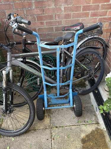 Two mens bikes and - two, lifting
