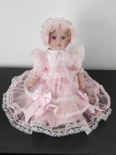 Leonardo Collection Vintage Seated Doll Porcelain Blue Eyes Pink Dress 10 In