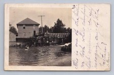 Boys Jumping Water Mill Wheel