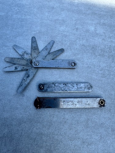 Three vintage feeler - , gauges