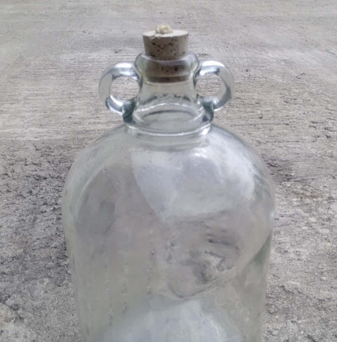Vintage glass demijohn with